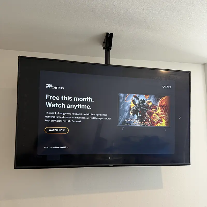 Fixed ceiling TV mount on drywall in Los Angeles apartment