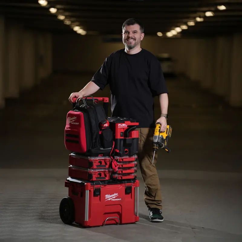 Igor Gray, founder of TVMOUNTED, with professional Milwaukee and DeWalt tools