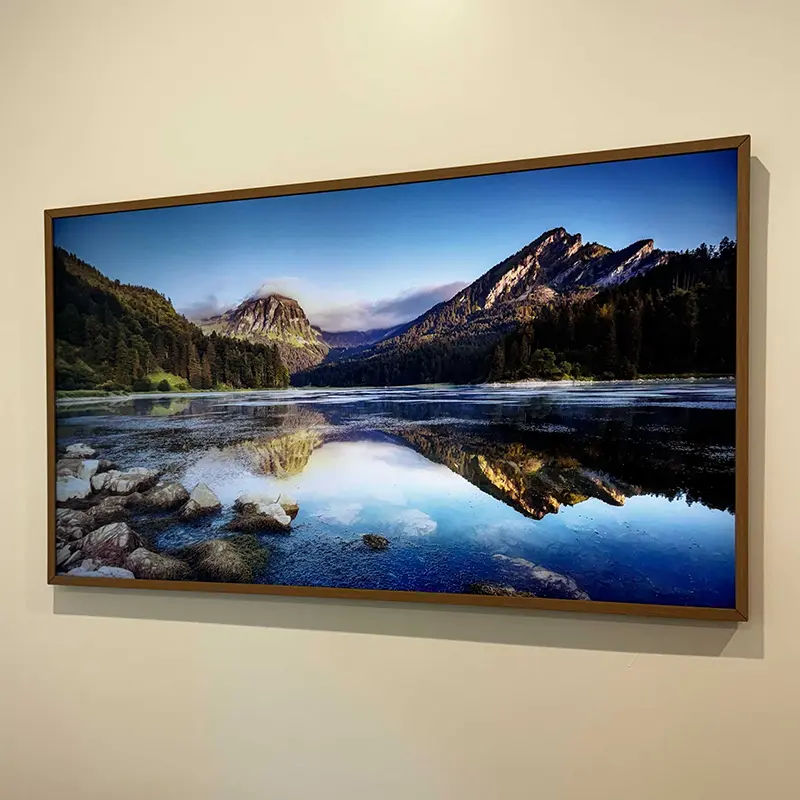 55-inch Samsung Frame TV mounted flush to wall, cables hidden, displaying art mode