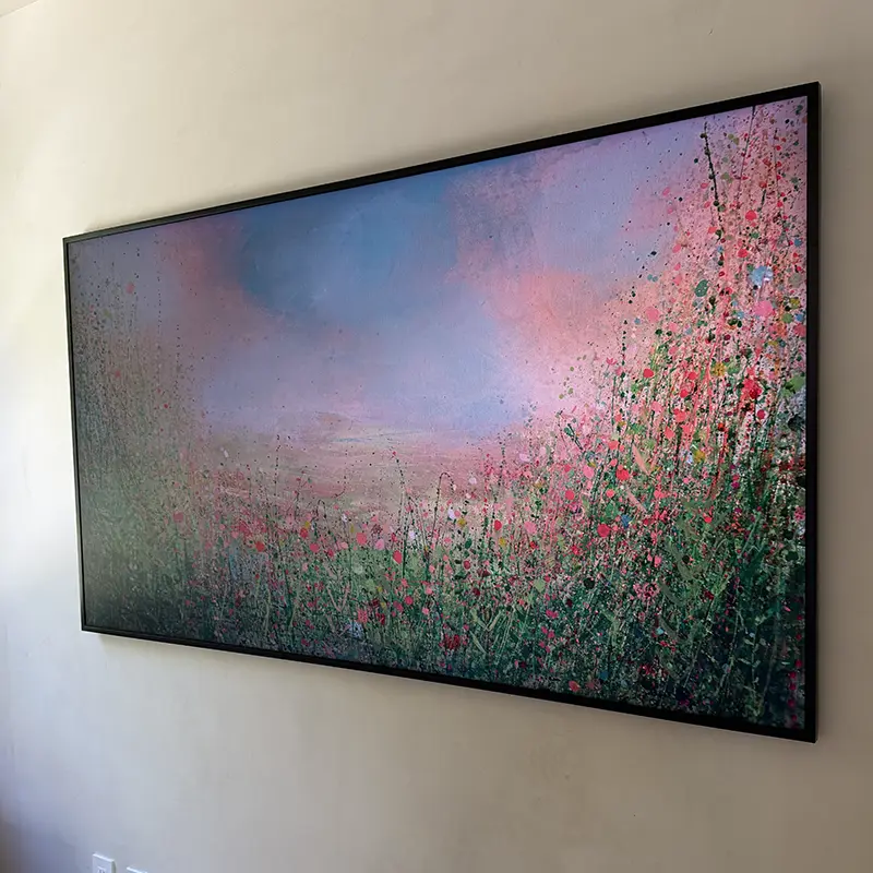 Samsung Frame TV mounted on Venetian plaster wall with flush-mount, no visible wires