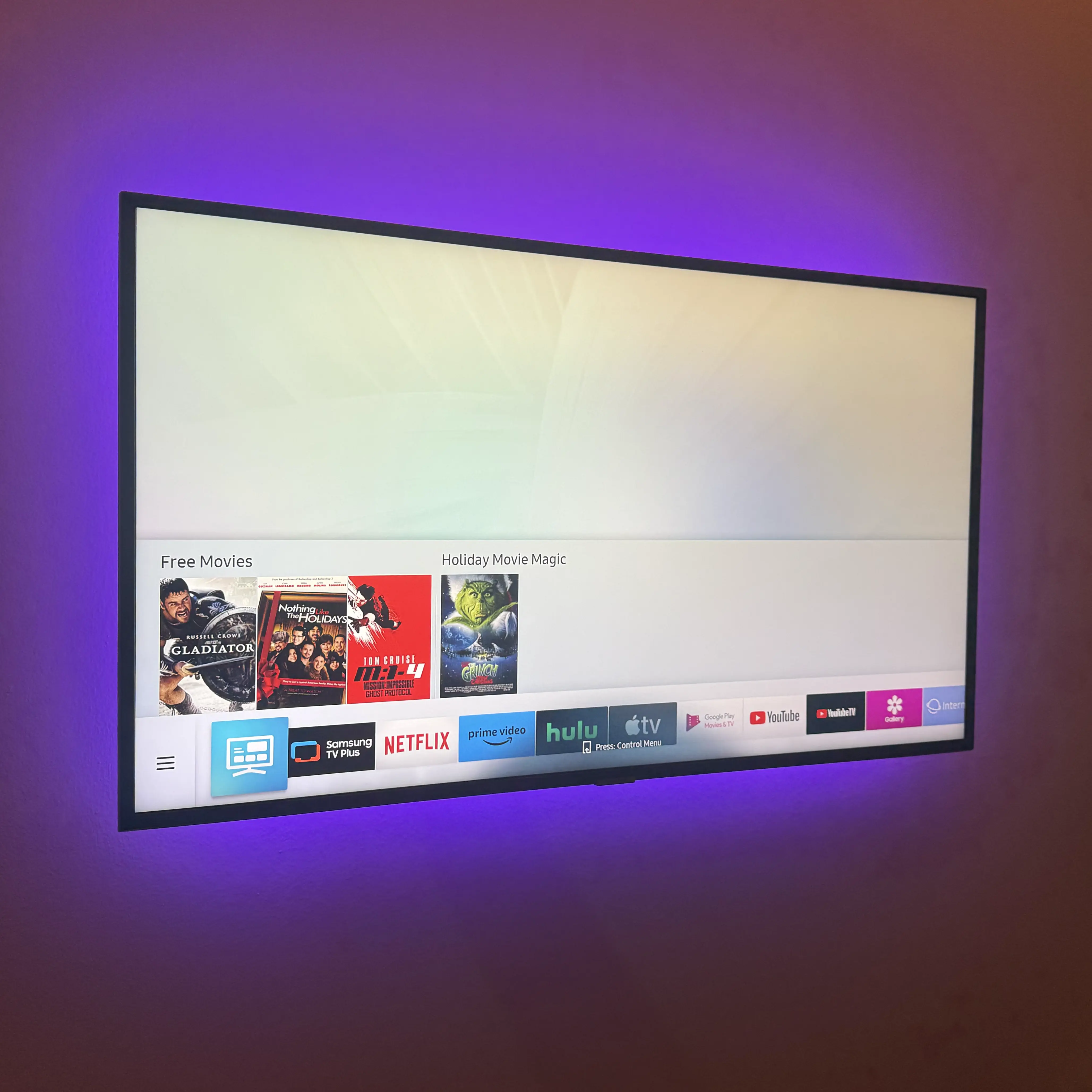 TV with standard LED strip backlighting in purple, controlled by remote