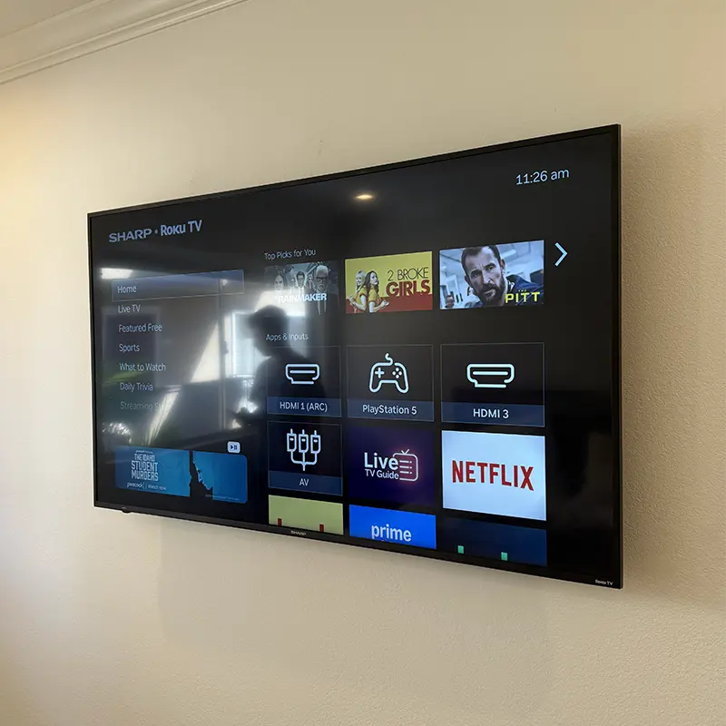 TV mounted with outlet directly behind for a clean minimalist look